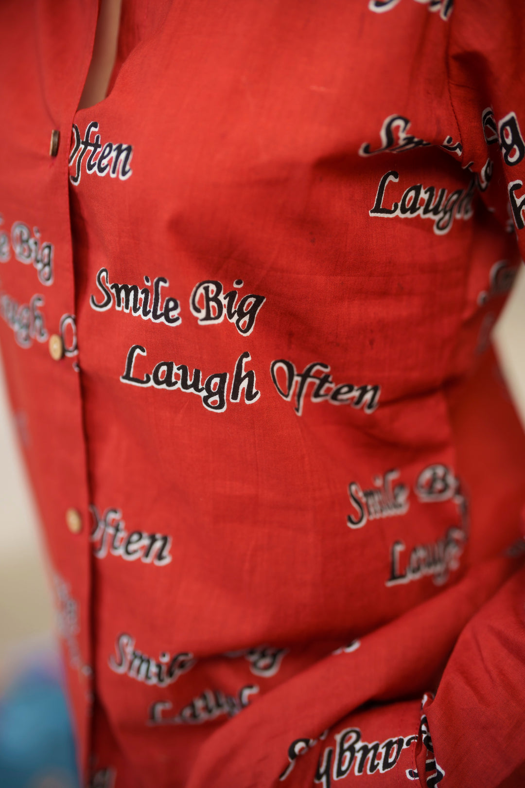 Red "smile big laugh often" cotton shirt