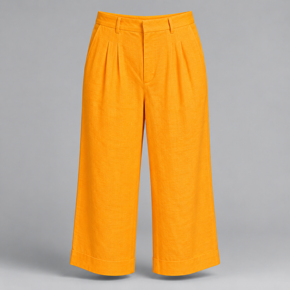 Bright yellow wide-leg cropped pants with pleated front detailing, shown on a neutral gray background.