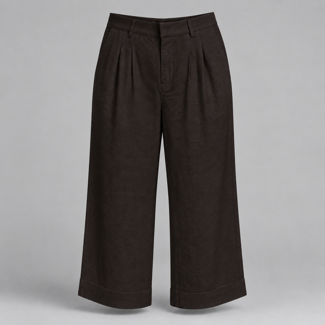 Dark brown cropped wide-leg trousers with pleated front details, shown on a neutral gray background.