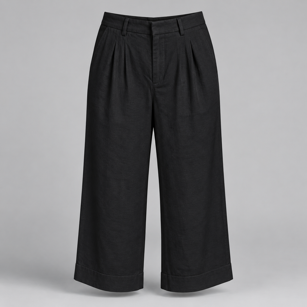 Black wide-leg cropped pants with pleated detailing at the front, shown on a neutral gray background.